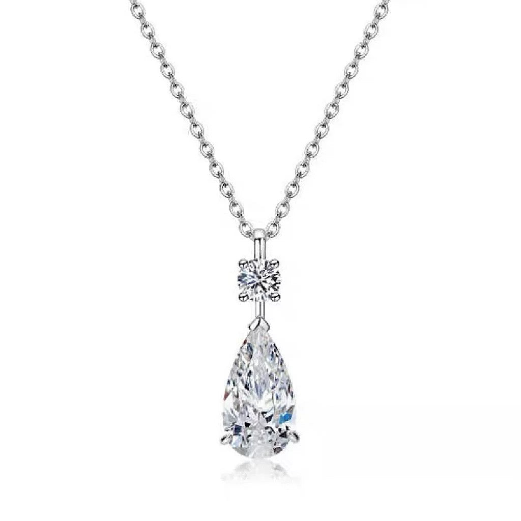 Drop Diamond Necklace and Earrings product render showing pear-cut CZ design