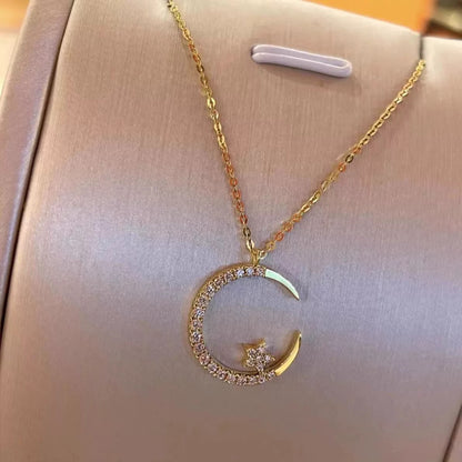 Close-up photo of Star and Moon Necklace showing star and moon pendant details
